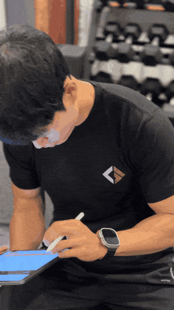 Trainer reviewing results with a client on a tablet