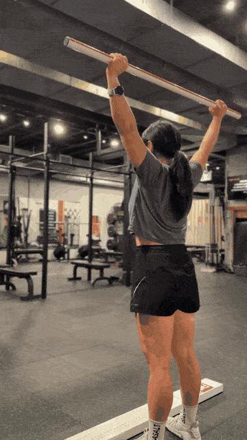 Client performing an overhead squat movement test